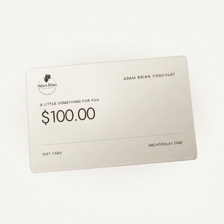 Adam Brian Chocolat $100 gift card with the circular logo on a warm ivory card